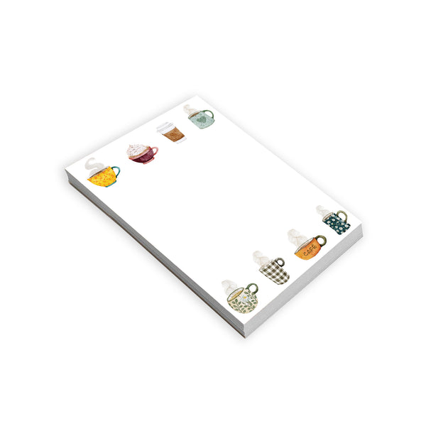 Notepad with coffee cups on a white background